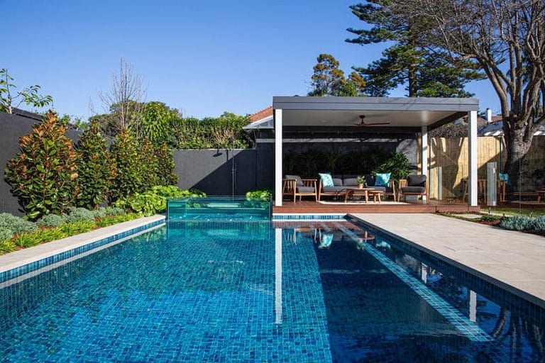 The full pool with the glass spa at its end and the pavilion lounge to one side.
